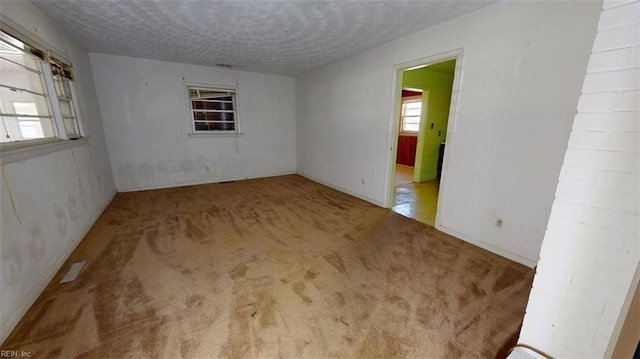3702 Nansemond Pkwy, Suffolk, VA 23435 - carpeted spare room featuring a textured ceiling