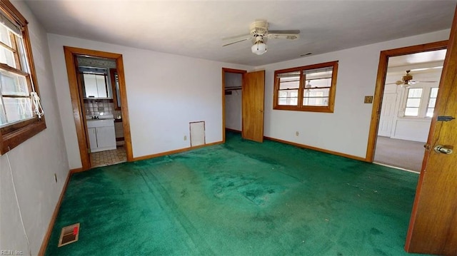 3702 Nansemond Pkwy, Suffolk, VA 23435 - unfurnished bedroom with carpet, baseboards, connected bathroom, and a ceiling fan
