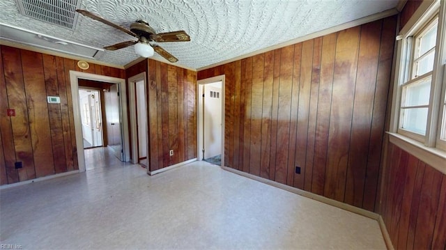 3702 Nansemond Pkwy, Suffolk, VA 23435 - empty room featuring ceiling fan, wooden walls, attic access, and ornamental molding