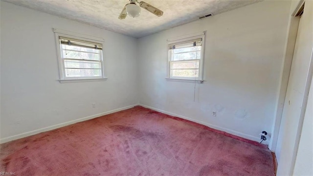 3702 Nansemond Pkwy, Suffolk, VA 23435 - carpeted spare room featuring healthy amount of natural light, baseboards, ceiling fan, and a textured ceiling