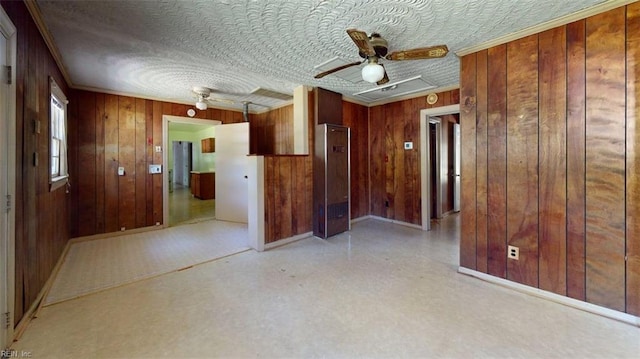 3702 Nansemond Pkwy, Suffolk, VA 23435 - unfurnished room with ceiling fan, wood walls, baseboards, and ornamental molding