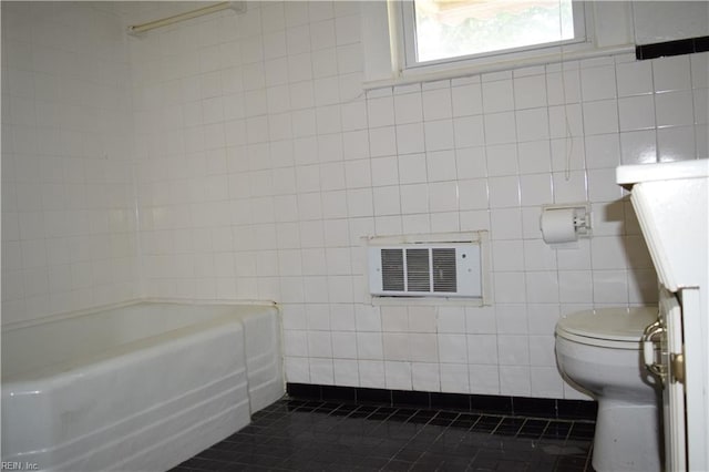 full bath featuring tile patterned flooring, toilet, tile walls, a shower, and a bath
