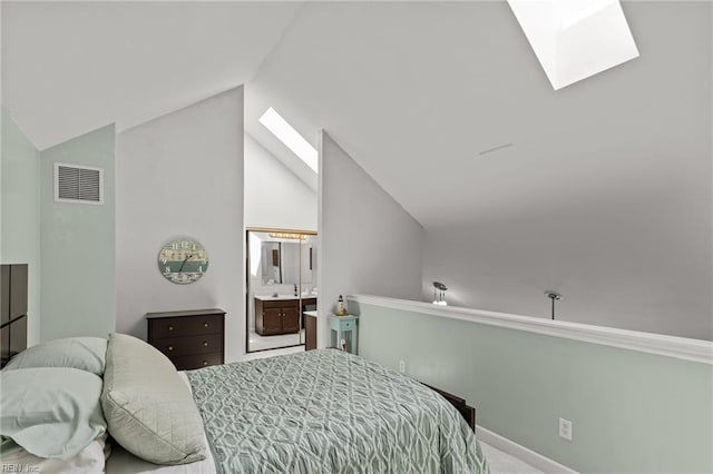 403 Harbour Pt Unit 305, Virginia Beach, VA 23451 - bedroom with visible vents, ensuite bathroom, baseboards, vaulted ceiling with skylight, and carpet