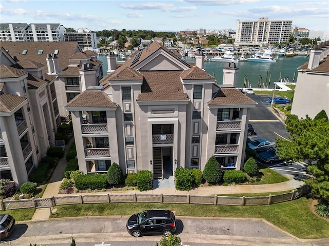 403 Harbour Pt Unit 305, Virginia Beach, VA 23451 - view of building exterior with a water view and fence