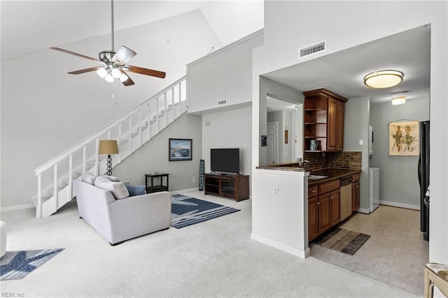 403 Harbour Pt Unit 305, Virginia Beach, VA 23451 - living room with a ceiling fan, visible vents, stairway, high vaulted ceiling, and light carpet