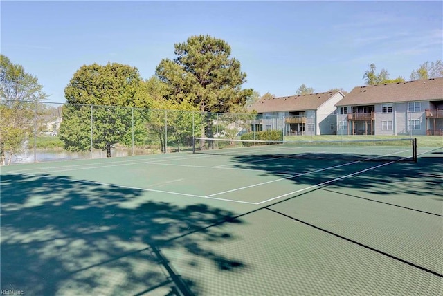 view of tennis court with fence