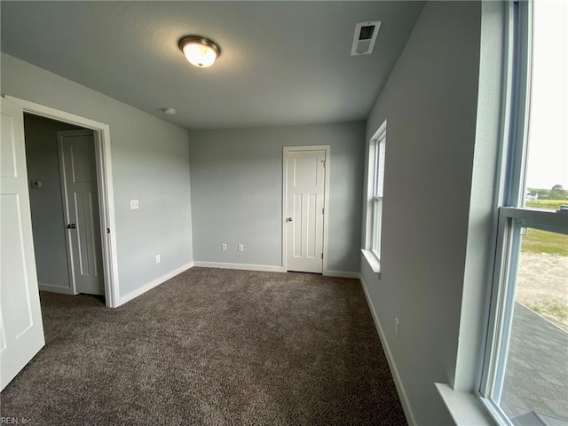 MM Savannah, Virginia Beach, VA 23456 - unfurnished room featuring baseboards, visible vents, and dark carpet