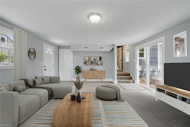 carpeted living room featuring visible vents