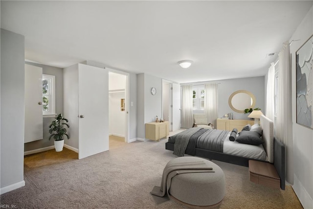 bedroom featuring baseboards and carpet flooring