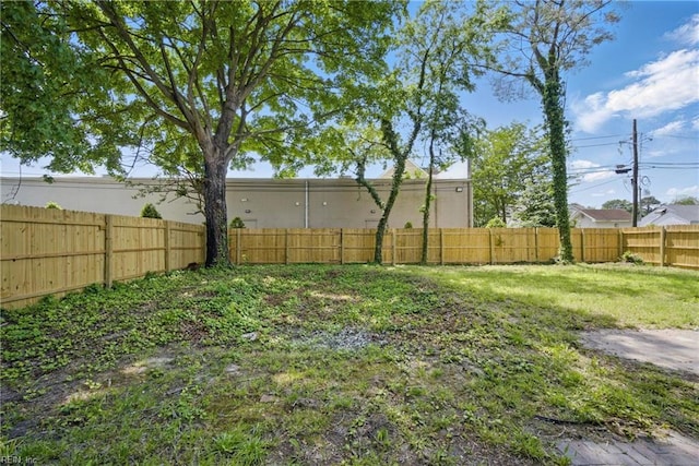 view of yard featuring a fenced backyard