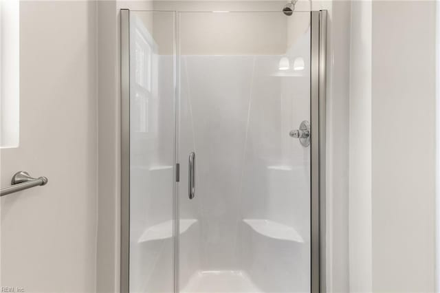 full bath featuring a stall shower