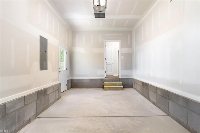 garage featuring a garage door opener and electric panel