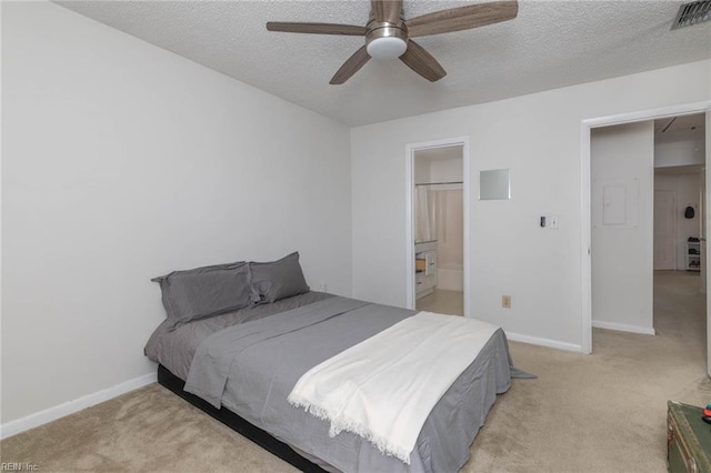 bedroom with light colored carpet, a textured ceiling, visible vents, and baseboards
