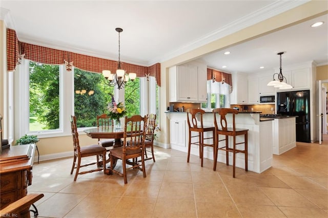 dining room featuring ornamental molding, light tile patterned floors, and a chandelier