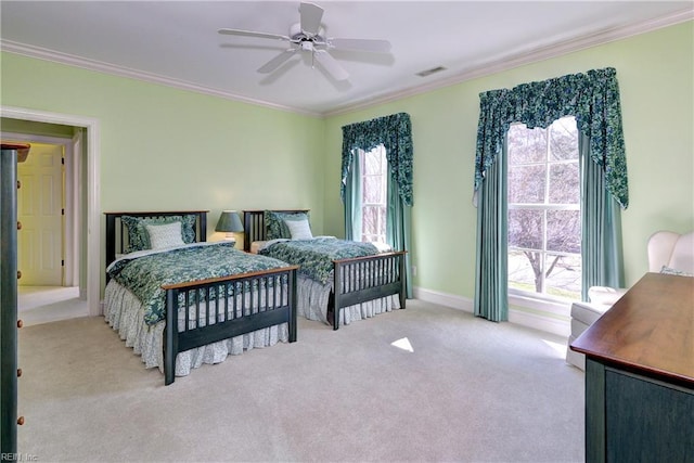 carpeted bedroom featuring crown molding, visible vents, and multiple windows