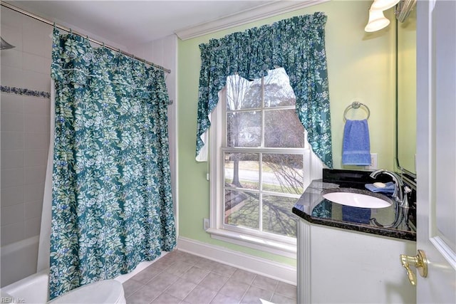 bathroom featuring tile patterned floors, baseboards, vanity, toilet, and ornamental molding