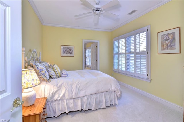 carpeted bedroom with crown molding, baseboards, visible vents, and ceiling fan