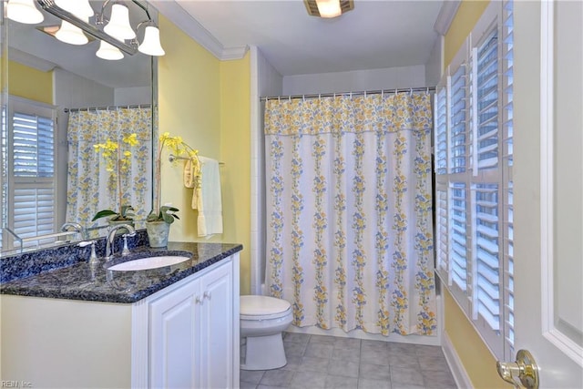 bathroom featuring tile patterned flooring, vanity, toilet, a chandelier, and a shower with shower curtain
