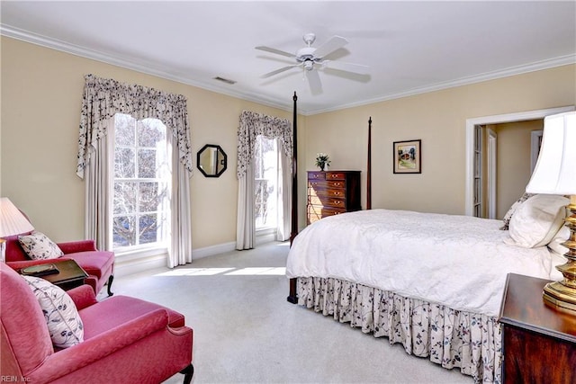 carpeted bedroom featuring crown molding, a ceiling fan, baseboards, and visible vents