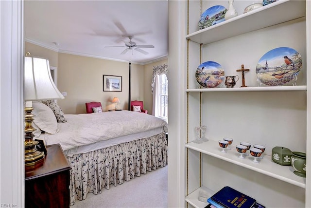 bedroom with crown molding, ceiling fan, and carpet flooring