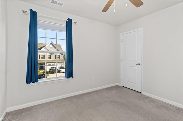 unfurnished room with visible vents, carpet flooring, and baseboards