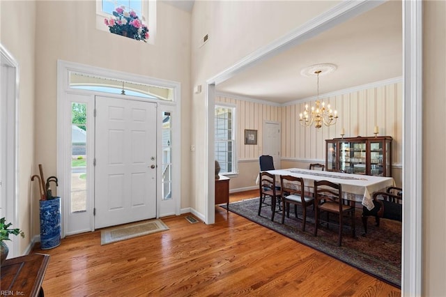 20639 Creekside Dr, Smithfield, VA 23430 - foyer with crown molding, baseboards, a notable chandelier, and wood finished floors