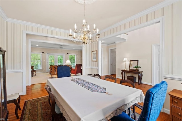 20639 Creekside Dr, Smithfield, VA 23430 - dining area featuring crown molding, baseboards, ceiling fan with notable chandelier, and wood finished floors
