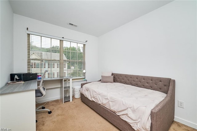 bedroom featuring carpet floors, baseboards, and visible vents