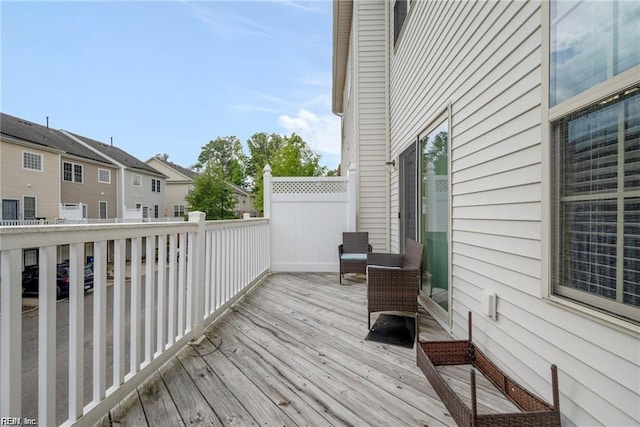wooden deck featuring a residential view