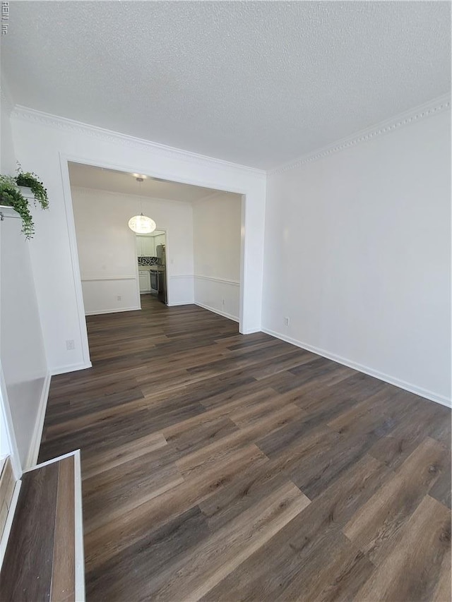 interior space featuring baseboards, a textured ceiling, and dark wood-type flooring