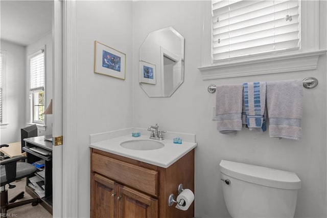 bathroom with vanity and toilet