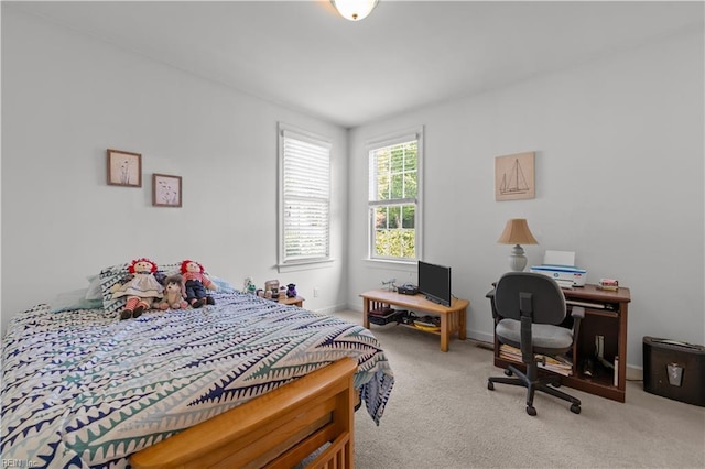 carpeted bedroom with baseboards