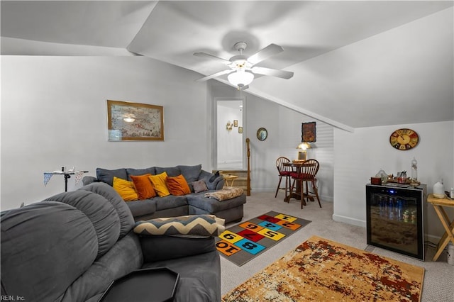 carpeted living area featuring baseboards, ceiling fan, and lofted ceiling