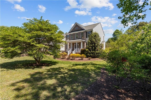 exterior space featuring a porch and a front yard