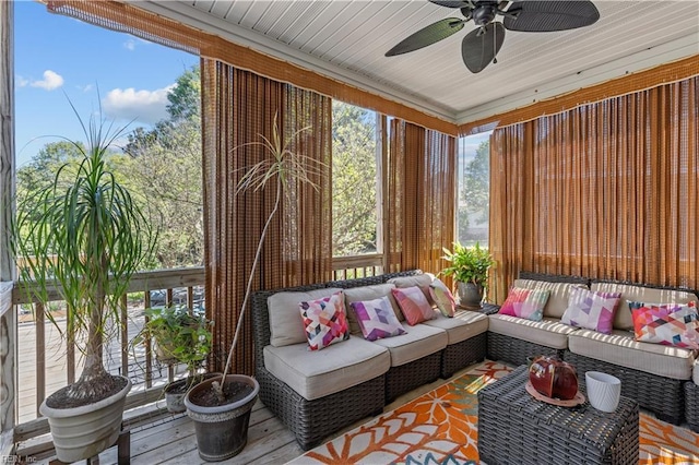 sunroom / solarium with ceiling fan and an outdoor hangout area