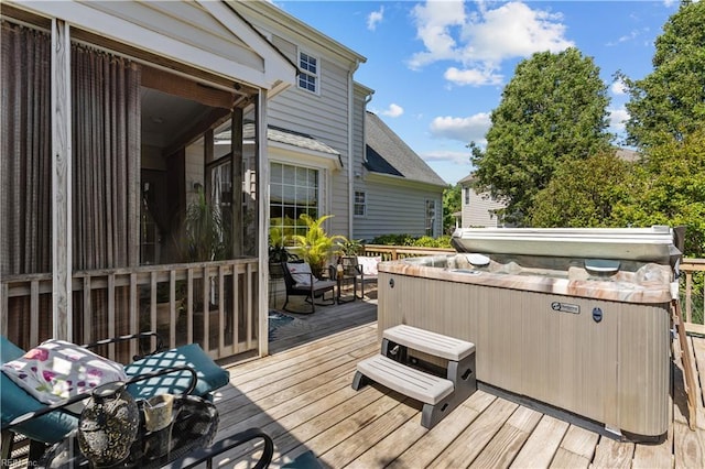 deck featuring a hot tub