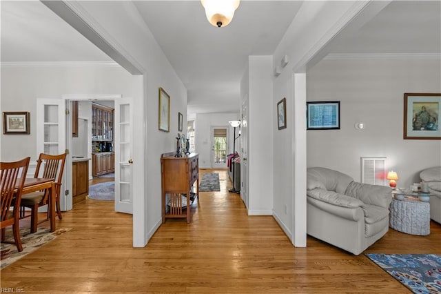entryway with light wood-style floors and baseboards
