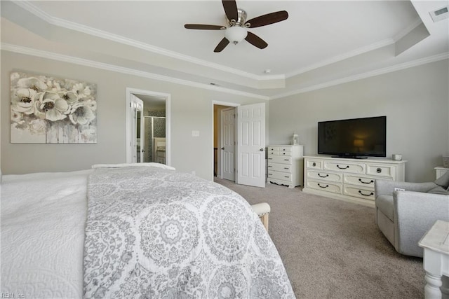 bedroom with crown molding, a raised ceiling, carpet, and visible vents
