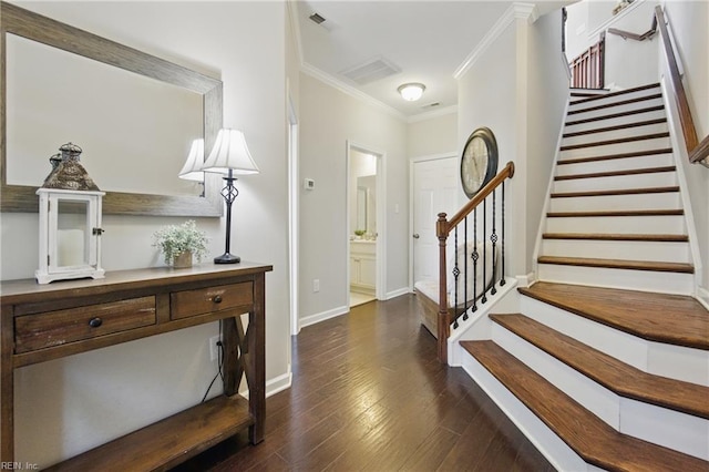 foyer entrance with crown molding, visible vents, dark wood-style flooring, baseboards, and stairway