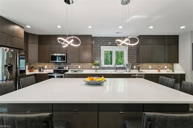 9924 Sycamore Landing Rd, Williamsburg, VA 23188 - kitchen with appliances with stainless steel finishes, decorative backsplash, and modern cabinets