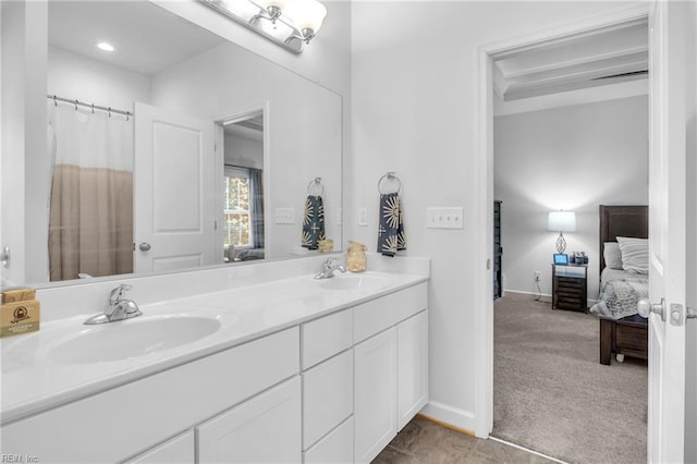 ensuite bathroom featuring connected bathroom, double vanity, and a sink
