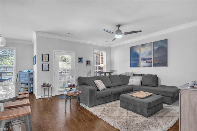 living area with visible vents, dark wood finished floors, and ceiling fan