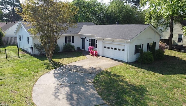 ranch-style home with fence, an attached garage, driveway, and a front yard