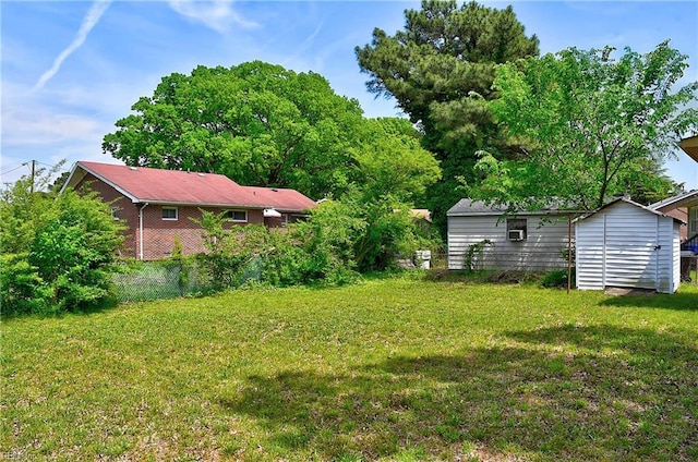 view of yard with an outbuilding and a shed