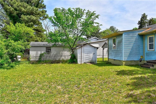 view of yard with an outdoor structure and a shed