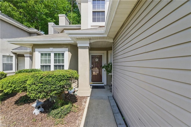 doorway to property with stucco siding