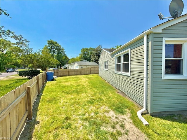 view of yard with a fenced backyard