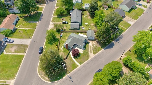 birds eye view of property with a residential view