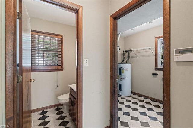 100 Hudgins Rd, Poquoson, VA 23662 - bathroom with tile patterned floors, vanity, toilet, and electric water heater