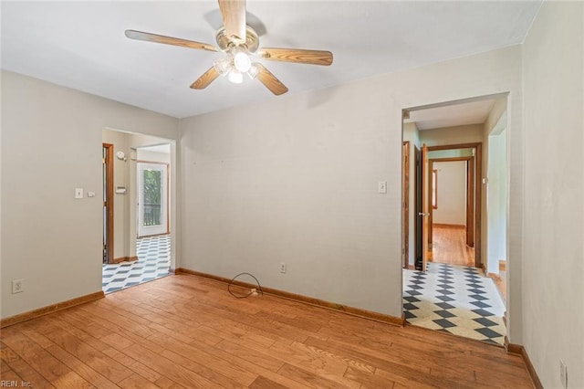 100 Hudgins Rd, Poquoson, VA 23662 - spare room featuring baseboards, a ceiling fan, and light wood finished floors